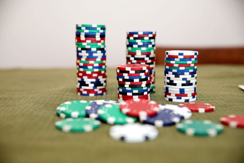 Stacks of poker chips on a green gaming table